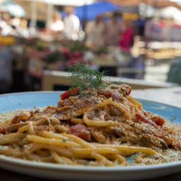Fish-based dish served by Fishiaria, a restaurant located in the fish market of Catania