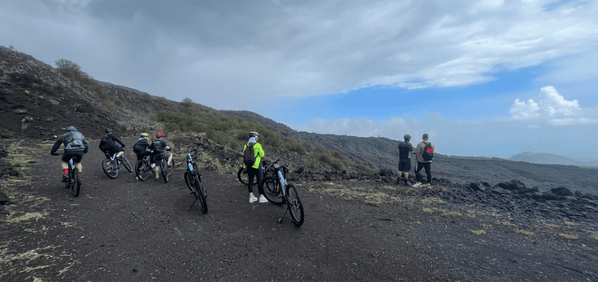 Hikers on e-bikes on Mount Etna