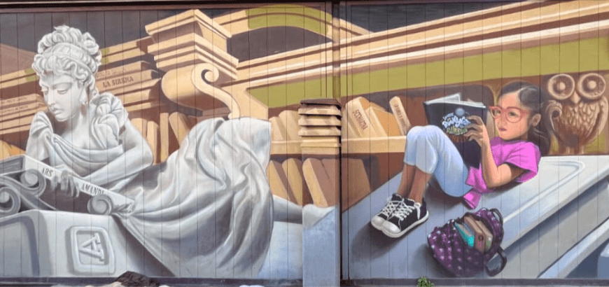 Mural of a girl reading