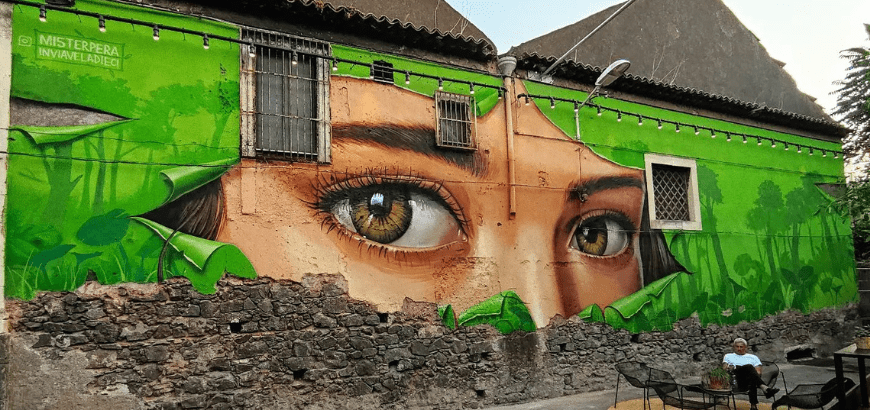 Woman's eyes, mural at Via Vela 10